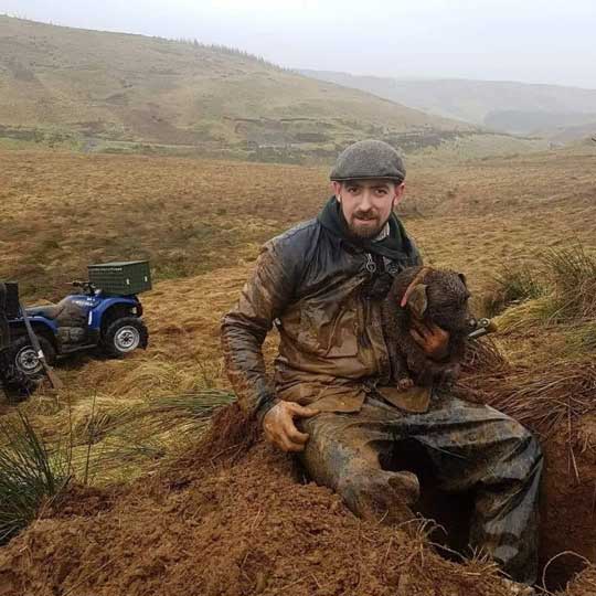 Robert Nevill caught on camera with a Patterdale terrier digging for wildlife